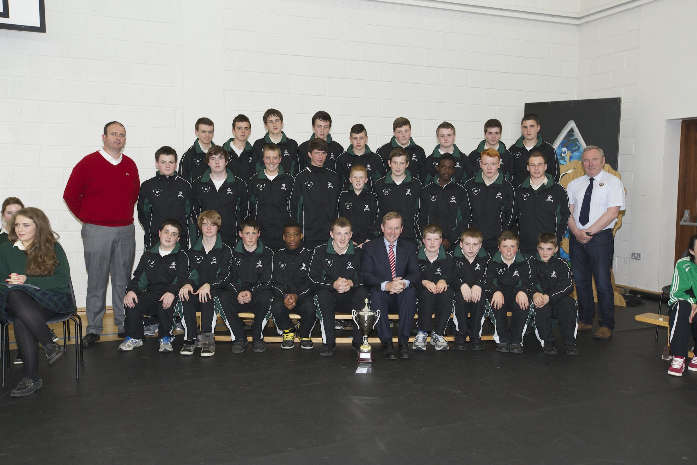 An Taoiseach, Enda Kenny TD pictured with the victorious Davitt College U16 Rugby Team that won the North West Championship Cup 2014. Accompanied with the team are Mr. Dave MacDonnacha, Teacher and Trainer (Left) and Mr. Seamus King, Trainer (Right).