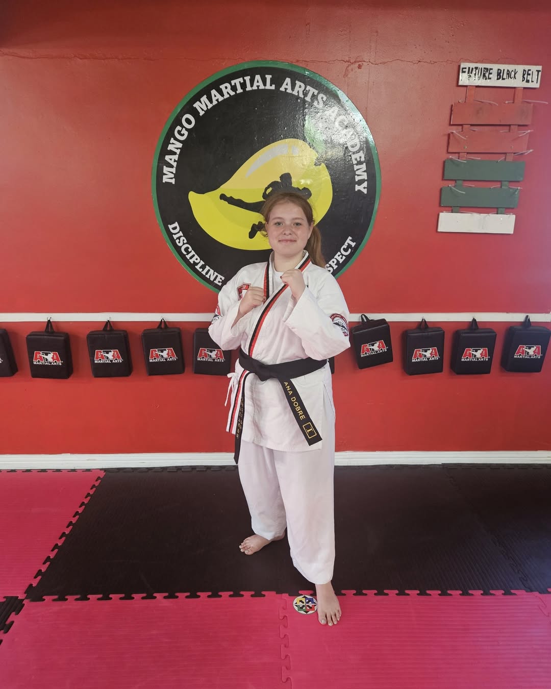 Anna Dobre Earns First Degree Black Belt in Taekwondo